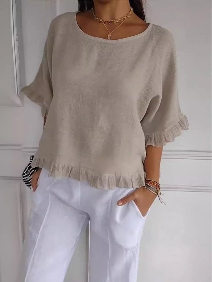 Flat lay or styled shot of the Amanda casual elegant blouse in beige showing overall design and fit