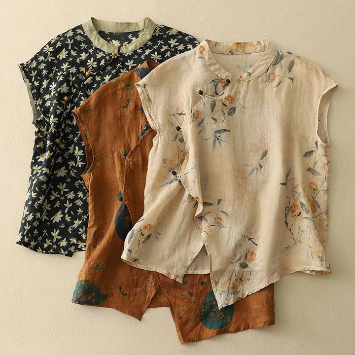Close-up of the angled button placket and miniature floral print on a sleeveless vintage-style top
