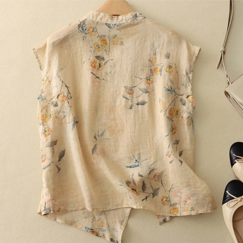 Side view of a flowy sleeveless floral top showing the relaxed silhouette and mandarin neckline