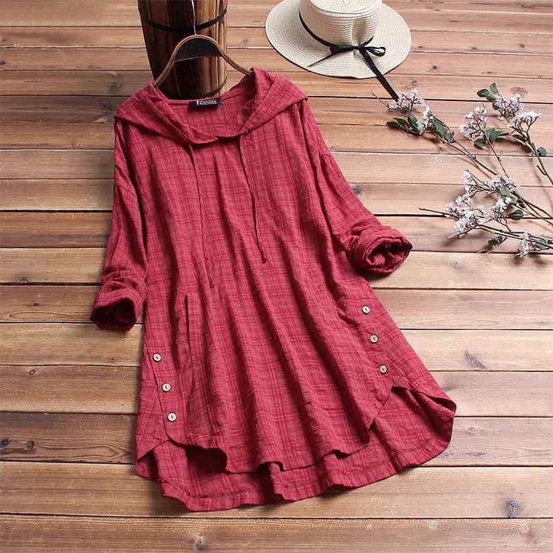 Model wearing the Amara plaid hoodie dress in a warm-toned color, styled for casual daily wear