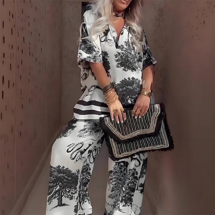 Close-up of the printed fabric and V-neckline detail on the black two-piece set