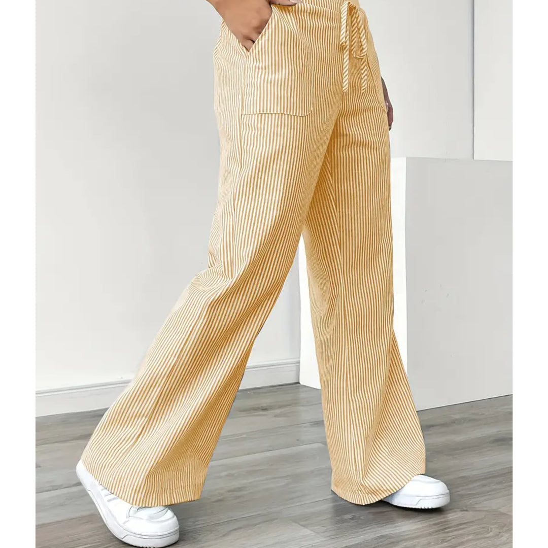 Close-up of vertical stripe pattern on lightweight striped pants in yellow