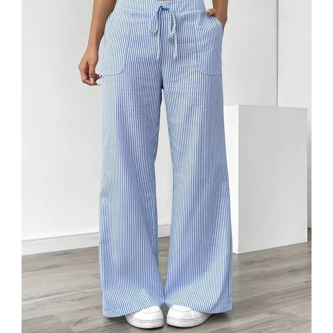 Woman in pink striped pants styled with a white fitted tee, casual everyday look