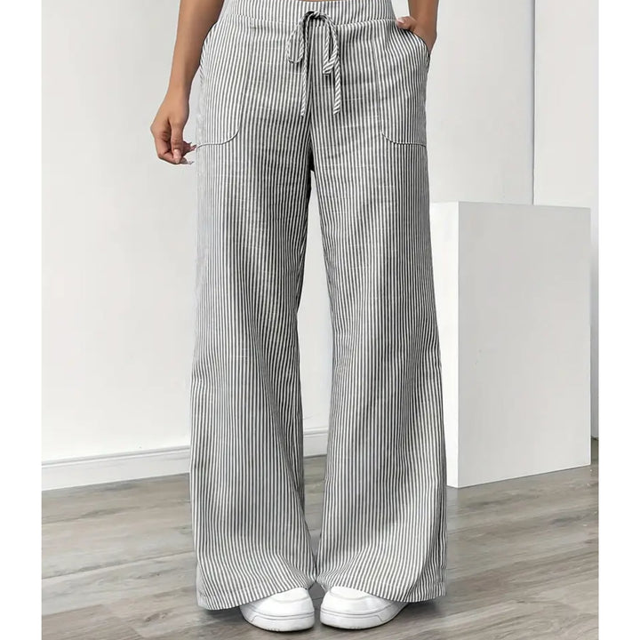 Four color options of striped pants — yellow, pink, blue, and grey — displayed together