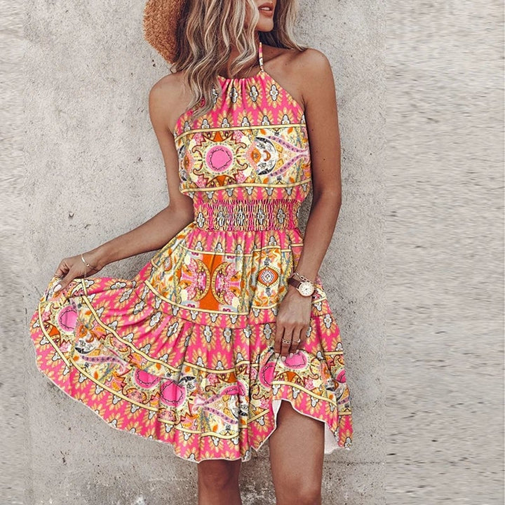 Woman wearing the Amber halter lace flowy draped dress in pink, featuring a flattering halter neckline and soft flowing silhouette