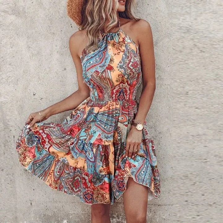 Woman in the Amber halter lace dress in light blue styled with strappy sandals for a summer occasion