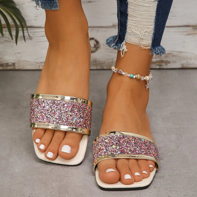 Close-up of rhinestone detailing on Amber women's sandals in green