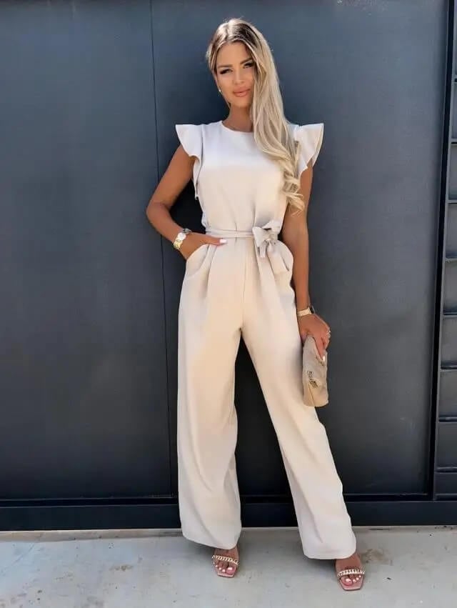 Amber ruffle sleeve wide-leg belted jumpsuit in beige, front view, showing self-tie waist belt and floor-length trousers