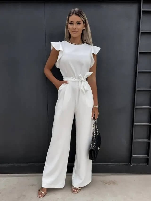 Close-up of layered ruffle cap sleeves on the Amber wide-leg jumpsuit in beige
