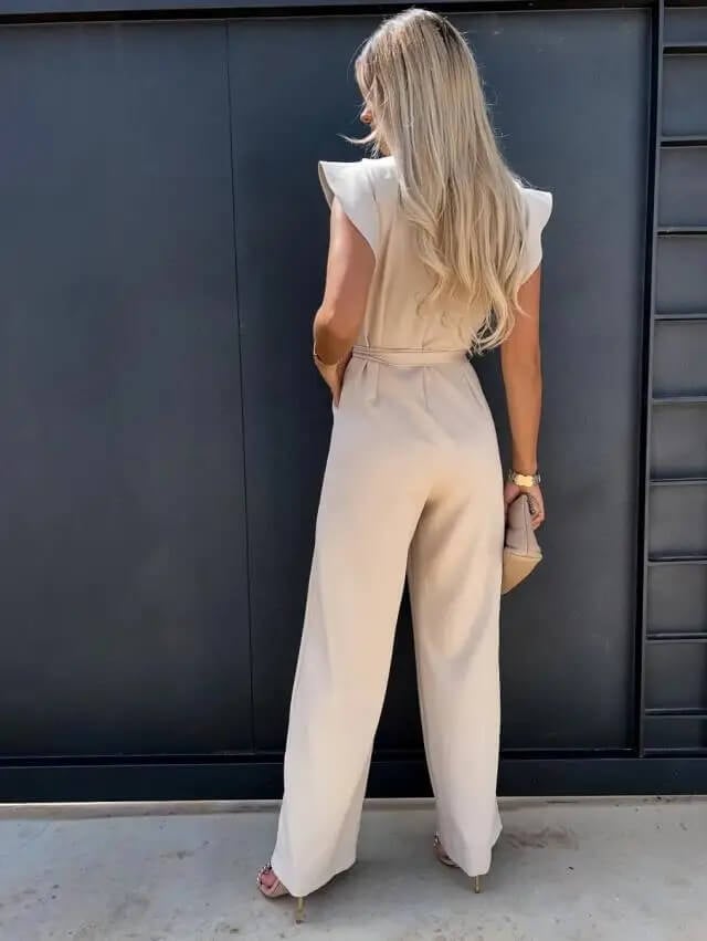Amber wide-leg jumpsuit in black, front view with self-tie waist belt cinched at natural waist