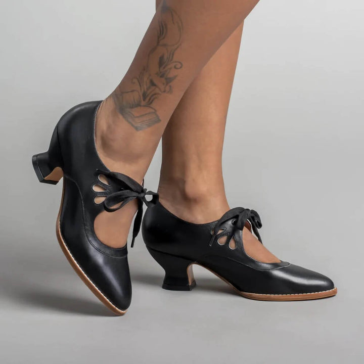 Amelia vintage pin-up heels with ankle strap in black, side view on white background