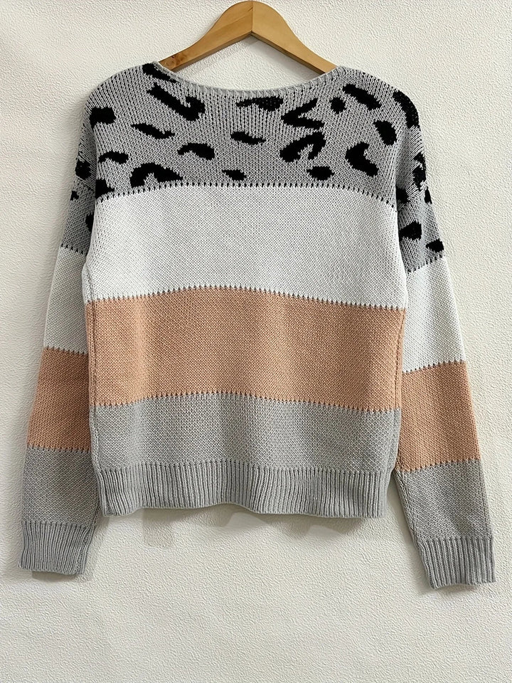 Side profile of the Amelia elegant sweater in beige highlighting the flattering drape