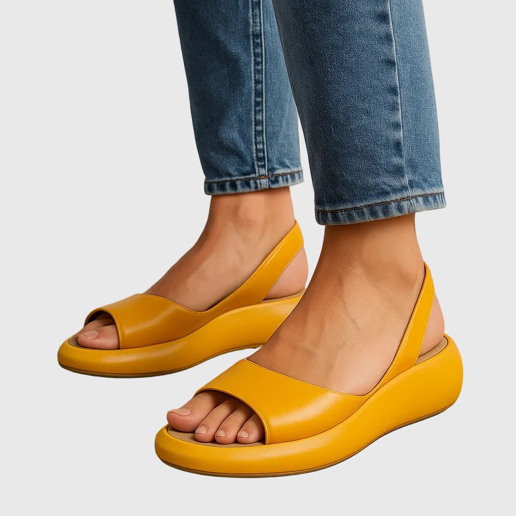 Amelia slip-on flat sandals in white, side profile view