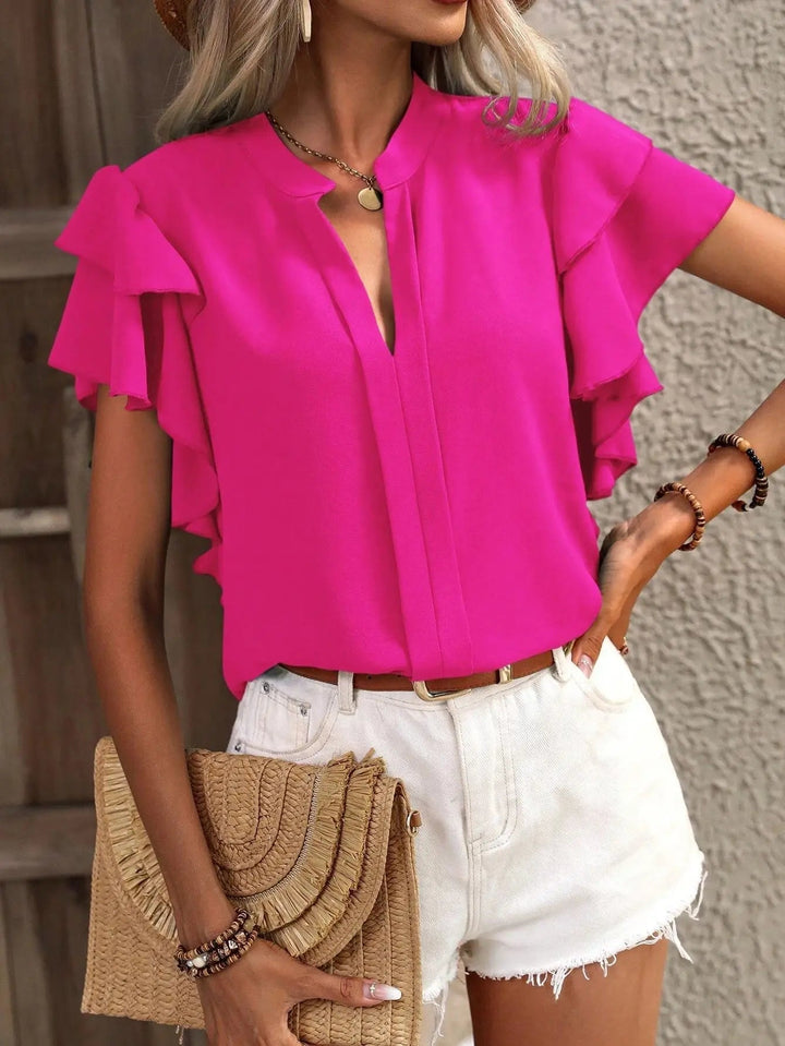 Close-up of the double-layered ruffle sleeve detail on the Amira chic blouse in soft pink