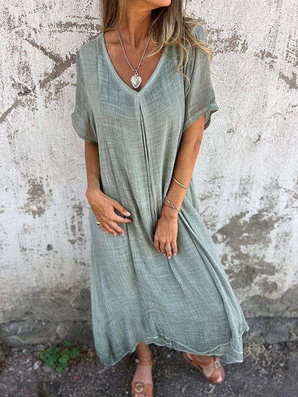 Close-up detail of the V-neckline and soft breathable fabric of a loose everyday dress