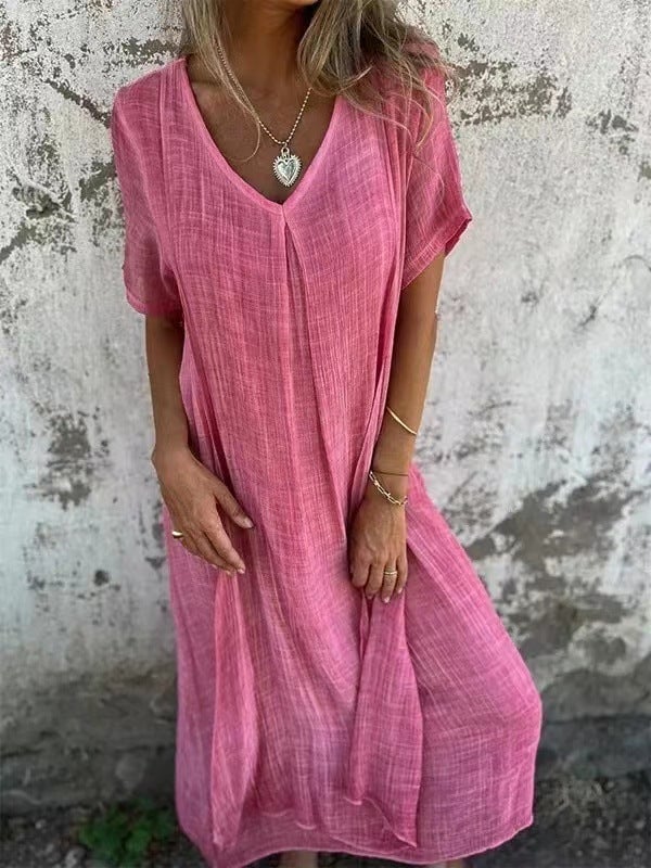 Lifestyle shot of a loose flowy V-neck dress styled for a casual warm-weather look