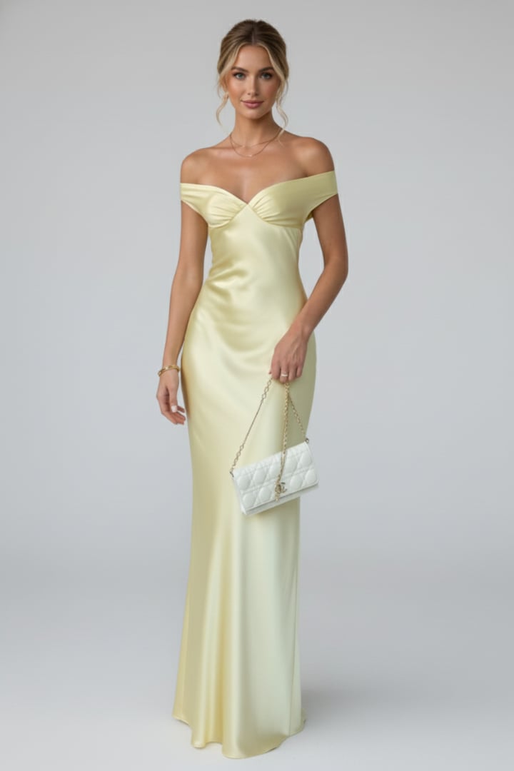 Front view of yellow off shoulder maxi dress highlighting the ruched bodice detail
