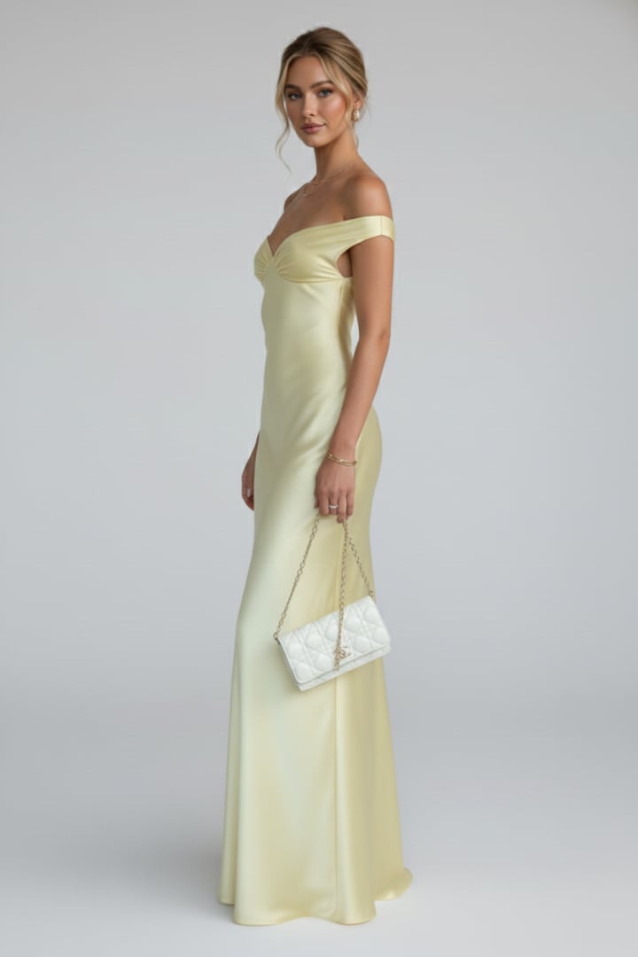 Close-up of the ruched bodice and off shoulder neckline on the yellow maxi dress