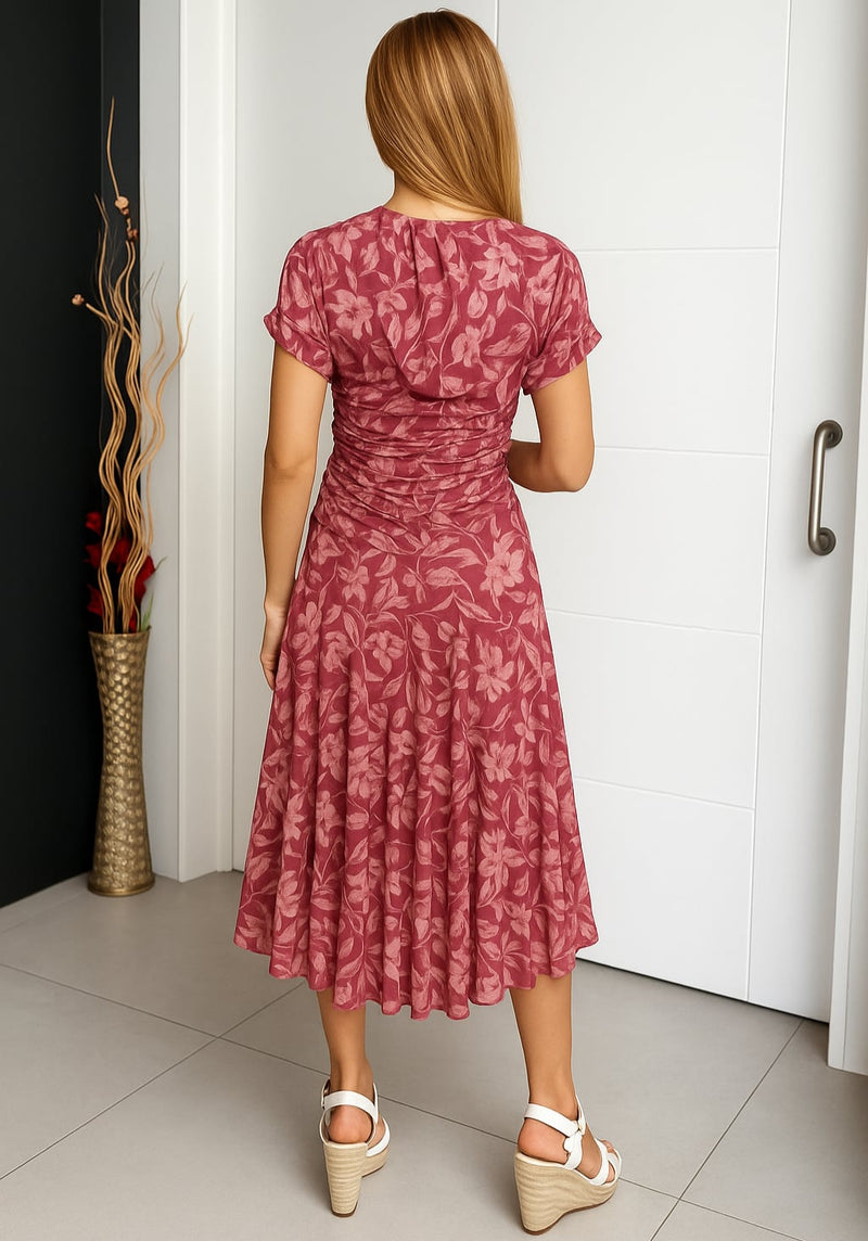 Model wearing a red off-shoulder floral midi dress, showcasing the graceful drape and midi length