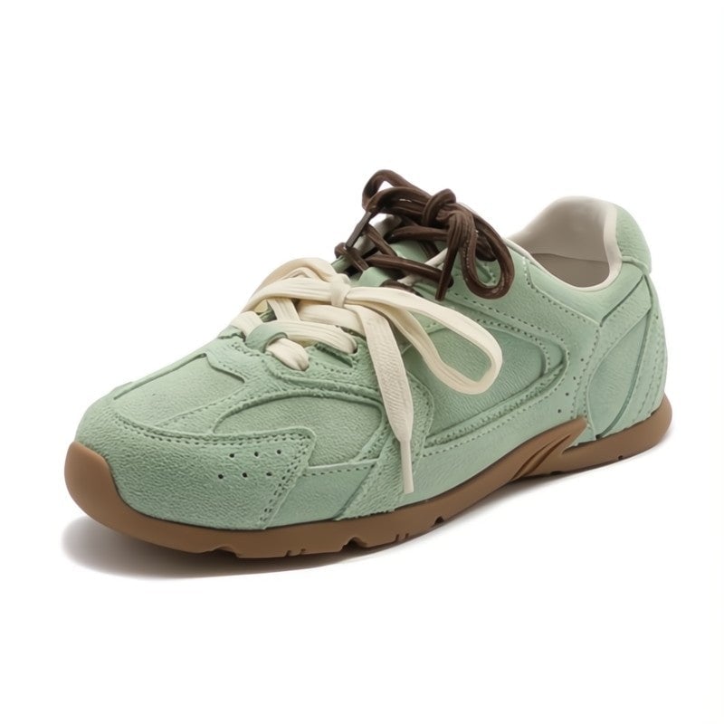 Anastasia suede sneakers in black, angled front view highlighting dual-lace design