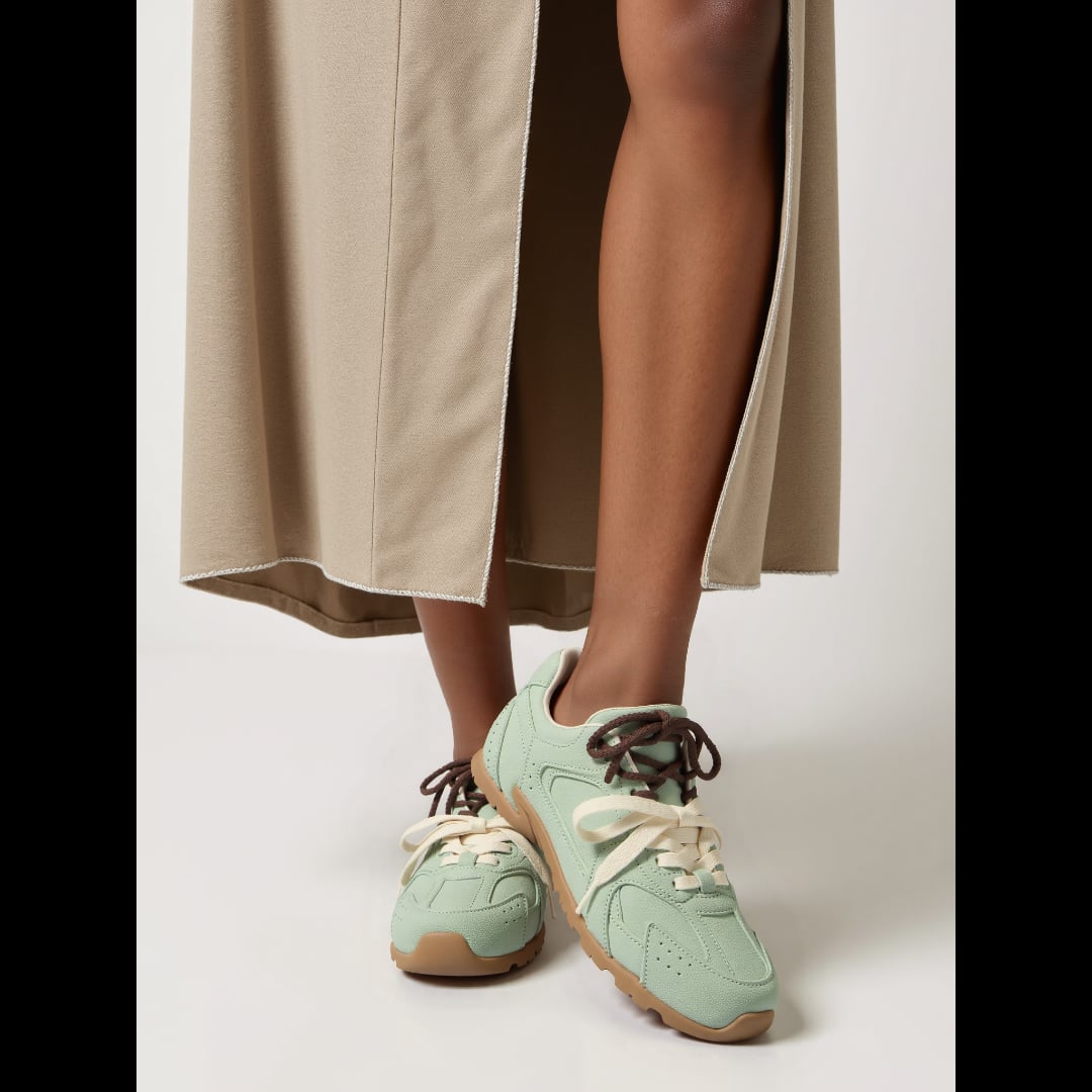Anastasia suede sneakers in gray, top-down view showing lace detail and suede texture