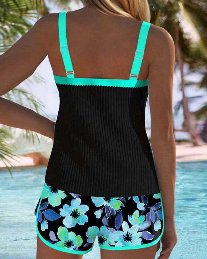 Close-up of the neckline and bust design on the Anastasia tankini in cyan