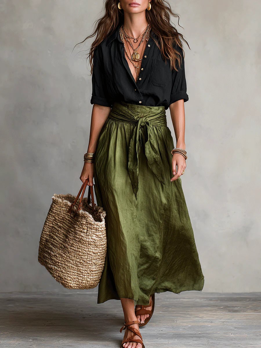 Woman wearing the Anastasia sage green button-up blouse and high-waisted maxi skirt two piece set, front view