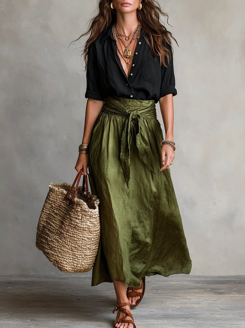 Woman wearing the Anastasia sage green button-up blouse and high-waisted maxi skirt two piece set, front view