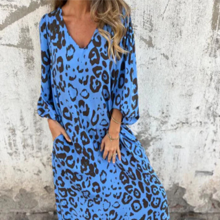 Andrea spring dress in turquoise showing the full-length flowing skirt in motion