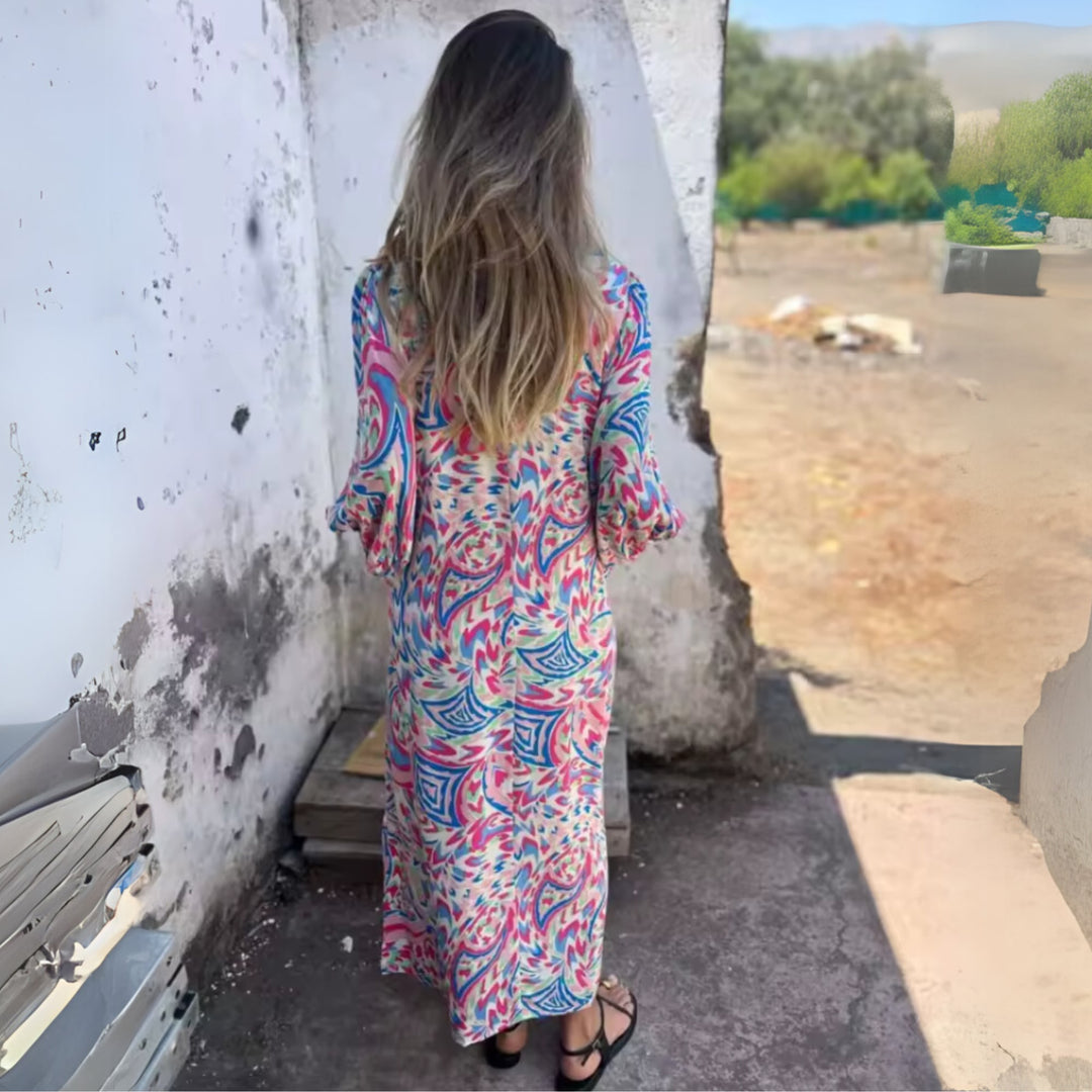 Side profile of the Andrea flowing spring dress in multicolor purple showing the relaxed fit