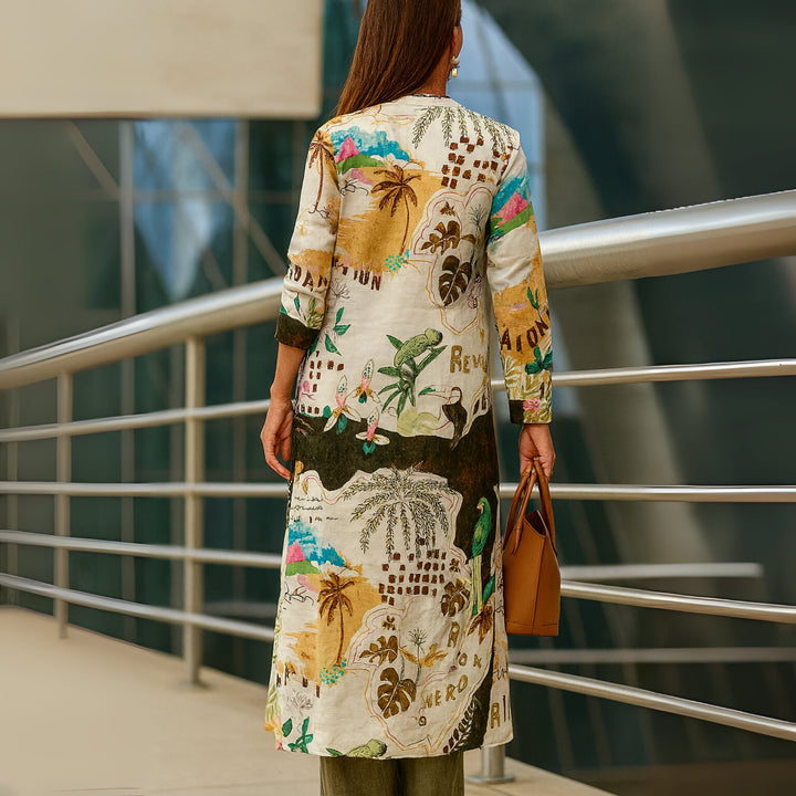 Close-up of the Andrea set's asymmetrical neckline and flowy fabric in yellow-green colorway