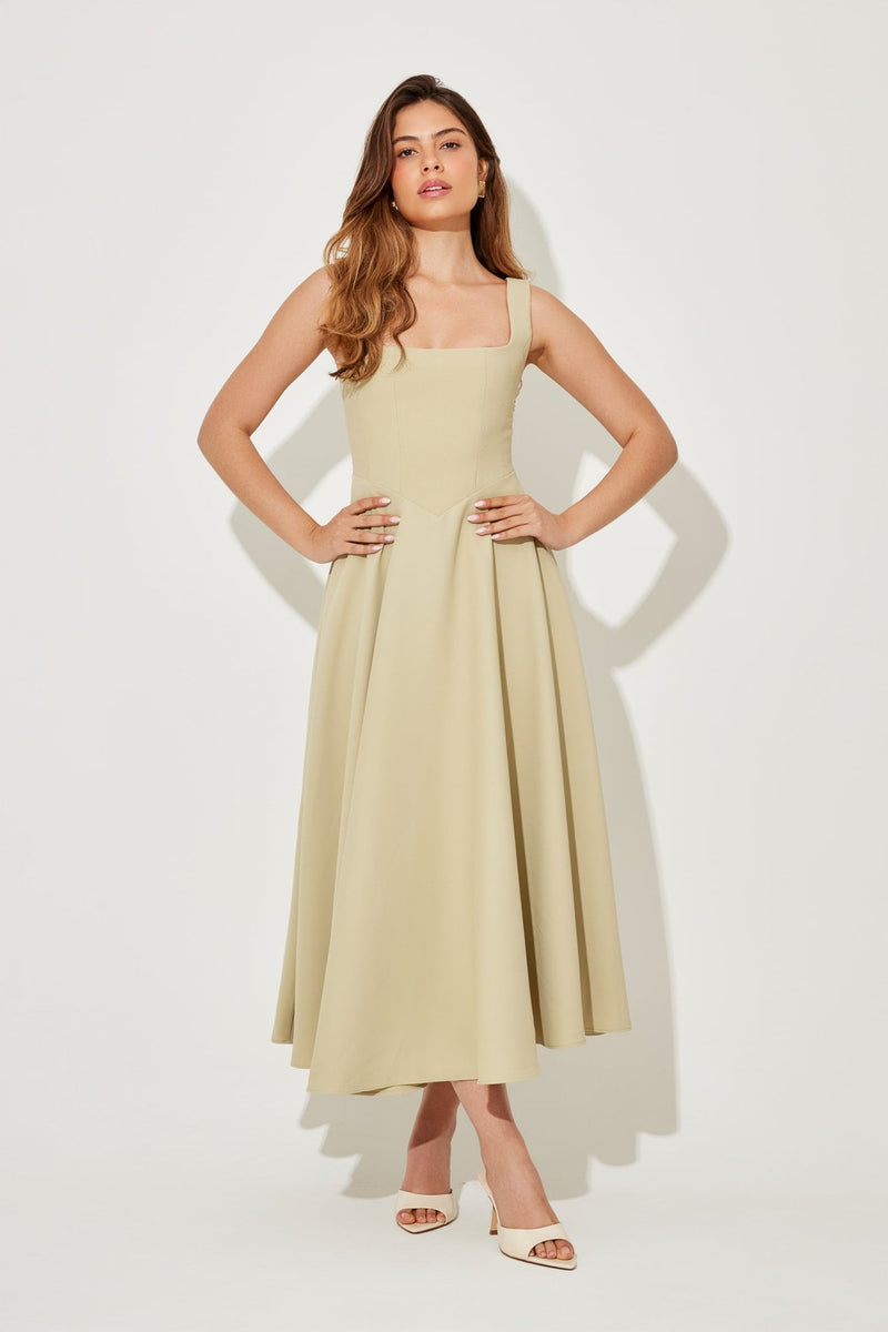 Full-length shot of the Florimay midi dress in black with a waist-defining silhouette