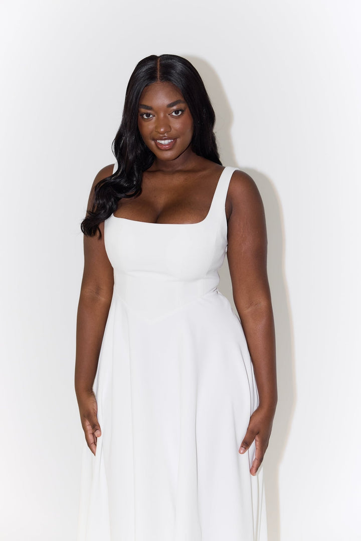Full-length front view of the Florimay flowy midi dress in sage green