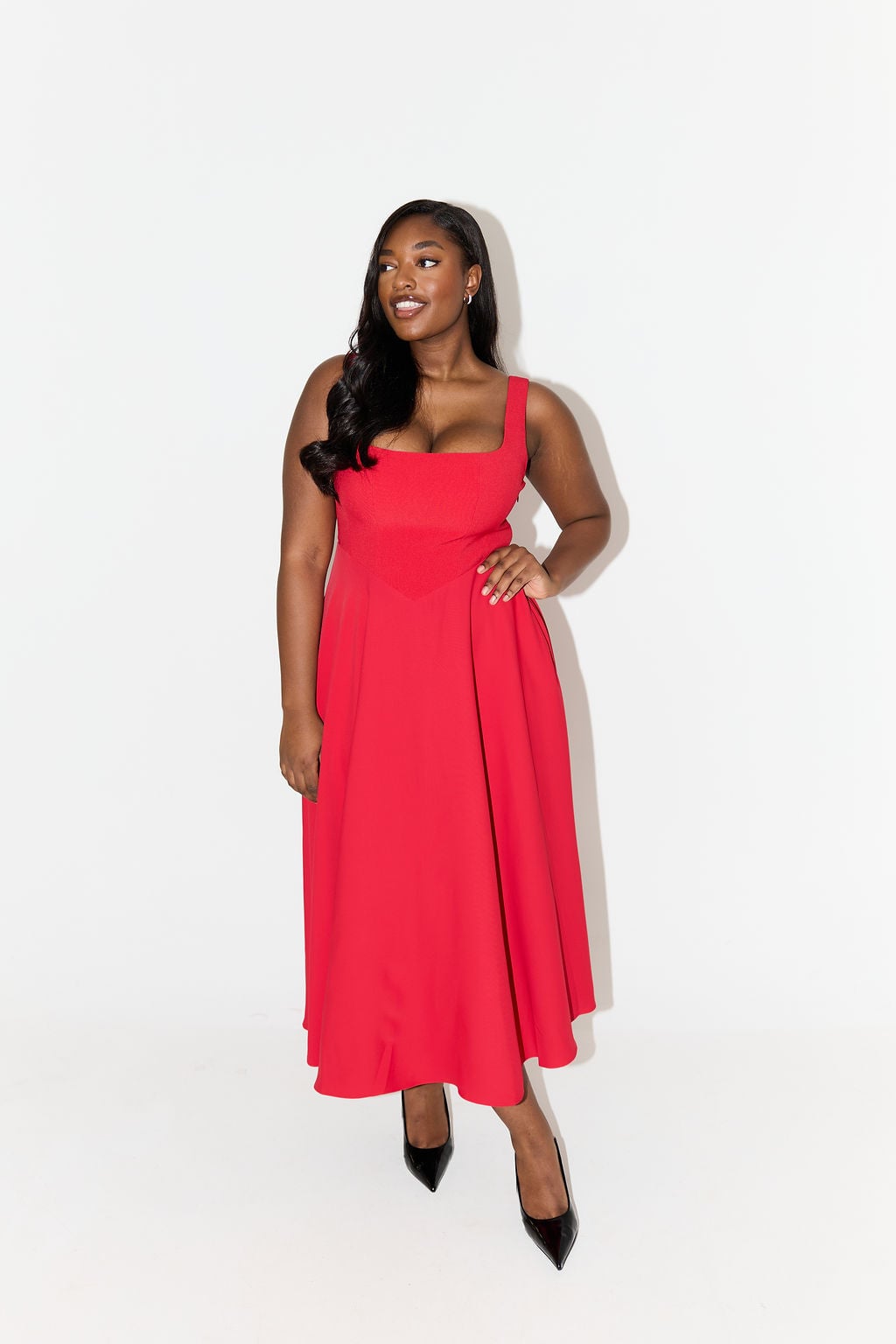 Flat lay of the red square-neck midi dress highlighting the skirt length