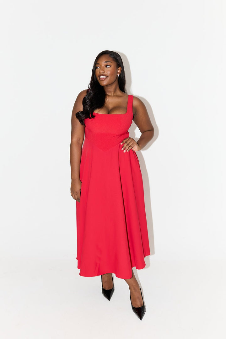 Flat lay of the red square-neck midi dress highlighting the skirt length