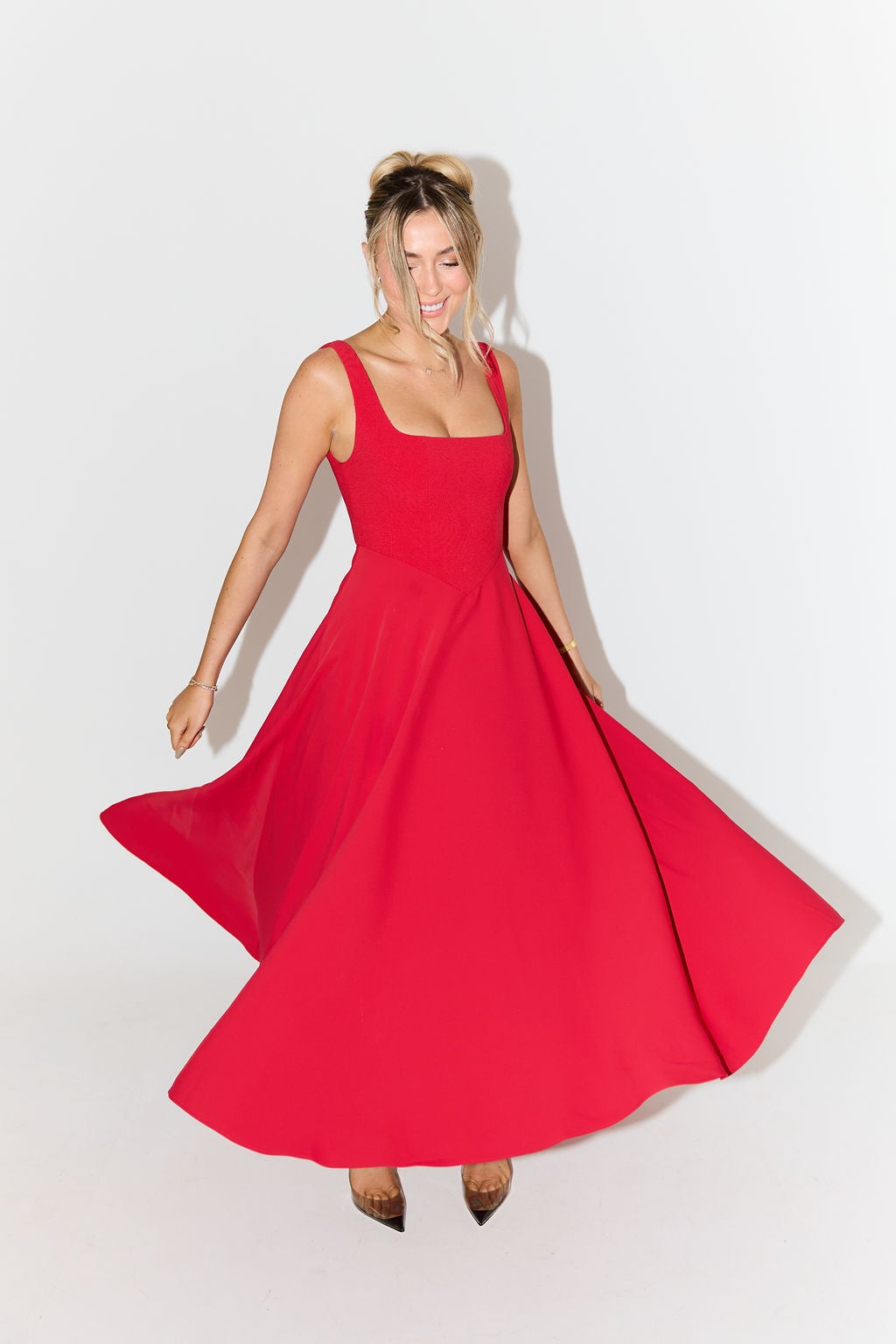 Detail shot of the fabric drape on the Florimay flowy midi dress