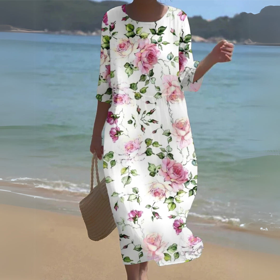 Woman wearing a chic floral midi dress with a flattering silhouette and romantic print, styled for a summer day out