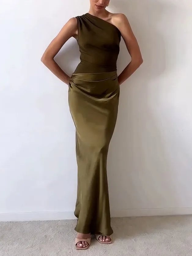 Detail shot of asymmetric one-shoulder neckline on a pleated formal maxi dress