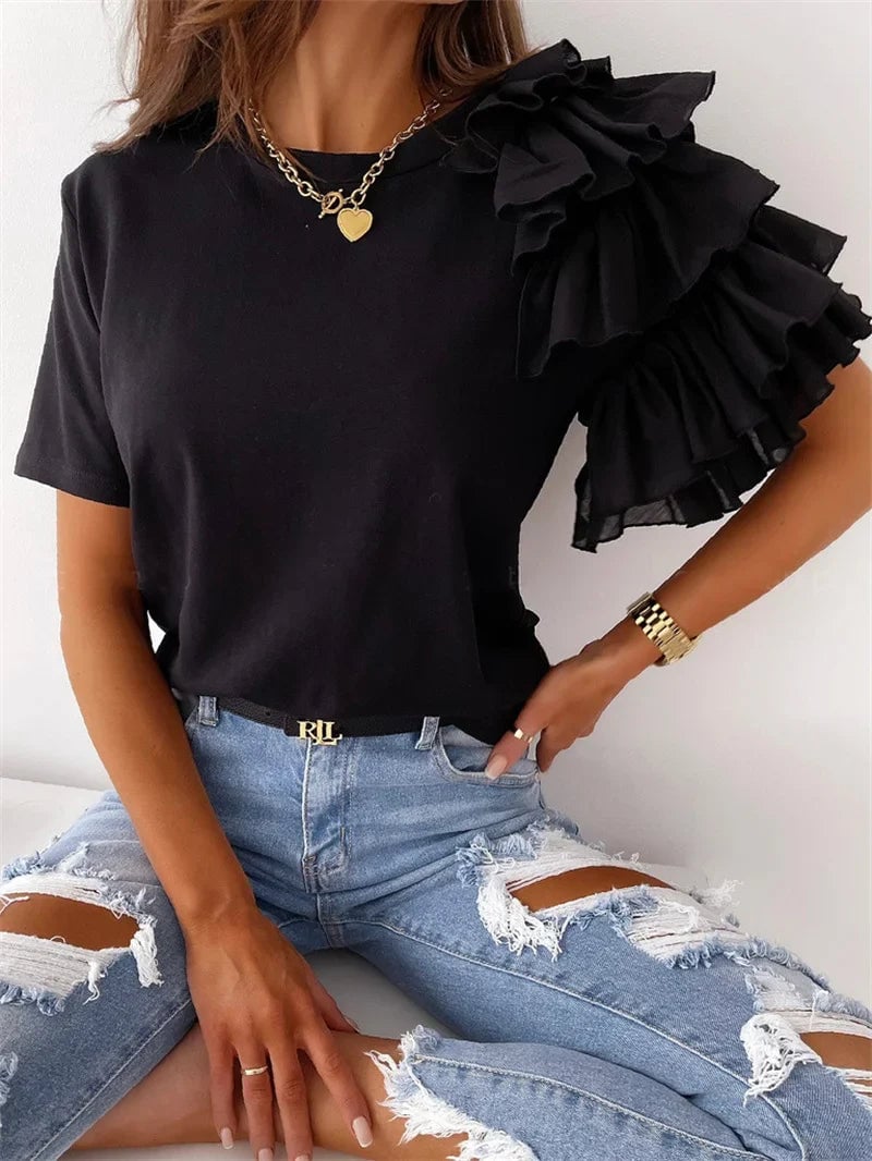 Close-up of bold ruffle sleeve detailing on a chic women's top in red