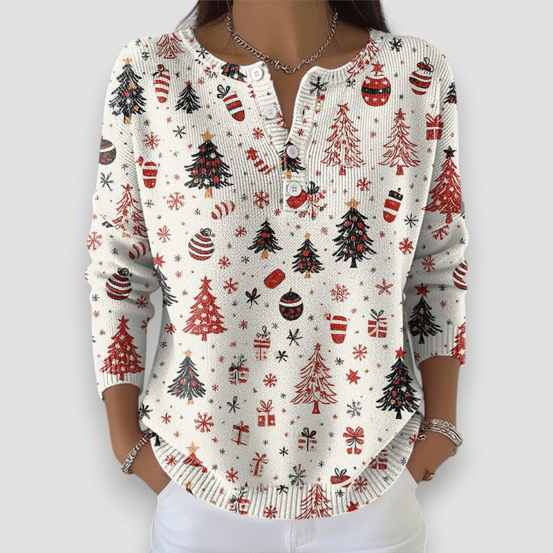 Close-up detail of white holiday sweater showing festive seasonal design and soft fabric texture