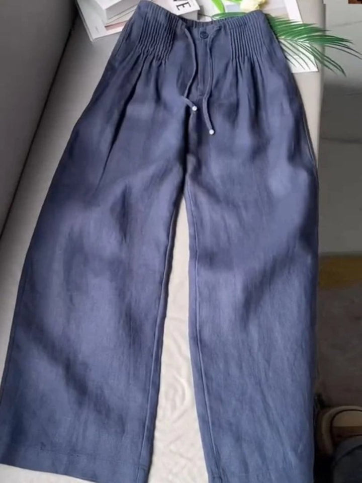 Model wearing Annabelle wide-leg pants in a flowing silhouette, front three-quarter view