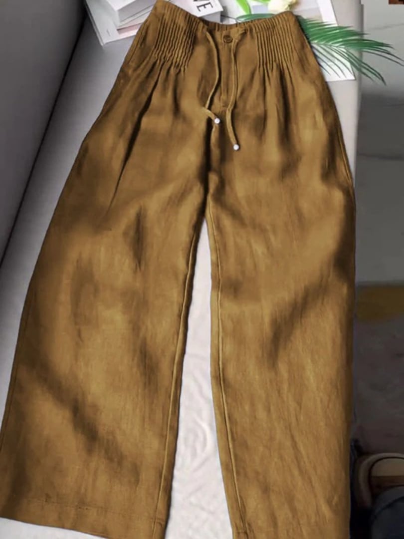 Model posing in Annabelle wide-leg pants showing full-length leg-elongating silhouette