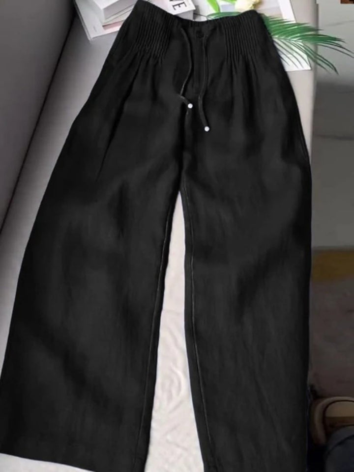 Flat lay of Annabelle wide-leg pants showing waistband detail and wide leg cut
