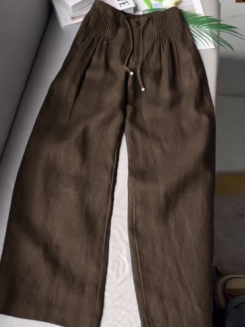 Model walking in Annabelle wide-leg pants showing graceful fabric drape in motion