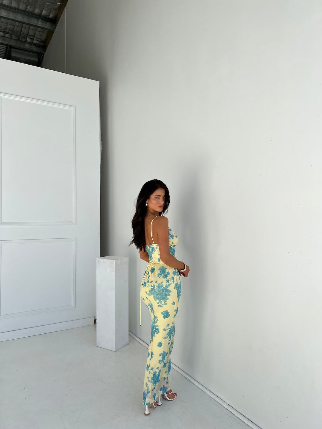 Close-up detail of the delicate floral print on the Annabelle yellow and blue maxi dress