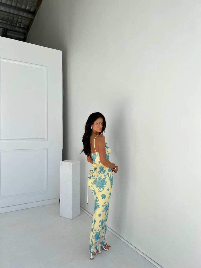 Close-up detail of the delicate floral print on the Annabelle yellow and blue maxi dress