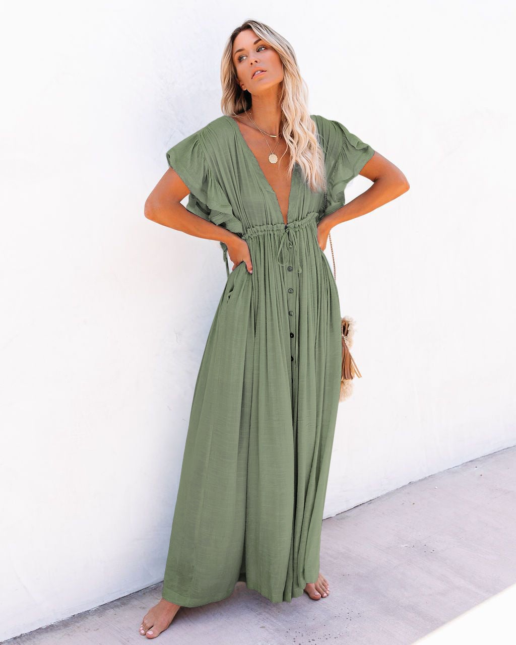 Woman styling the Annabelle boho kimono cover-up over a swimsuit on a sunny beach setting