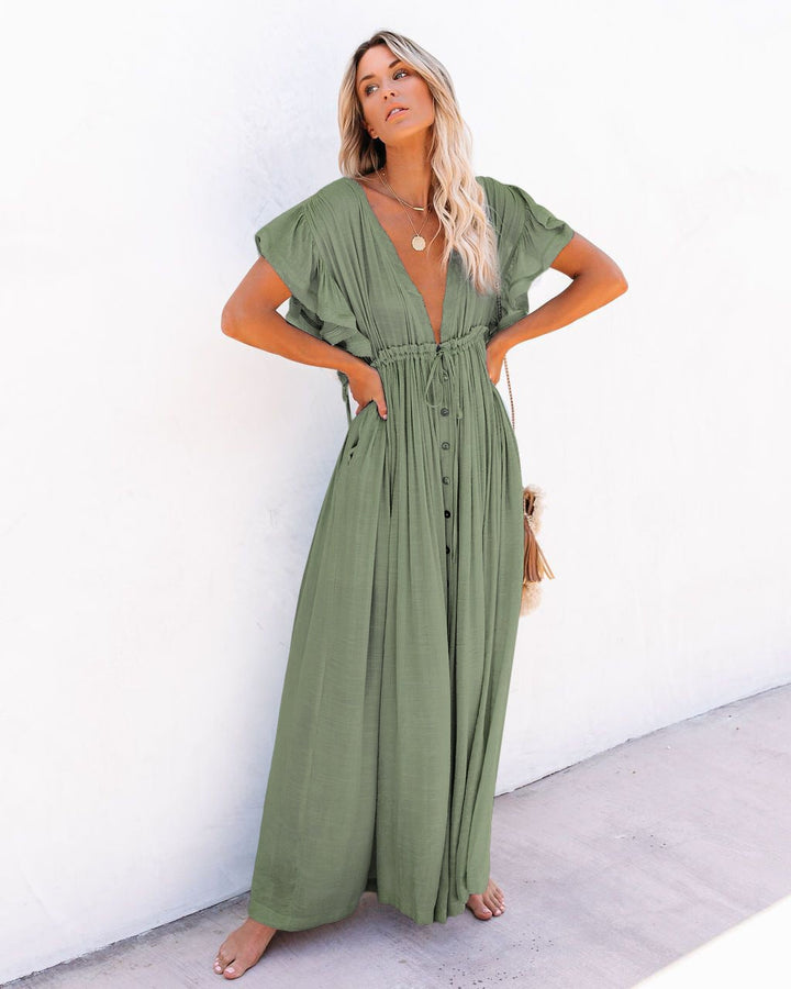 Woman styling the Annabelle boho kimono cover-up over a swimsuit on a sunny beach setting