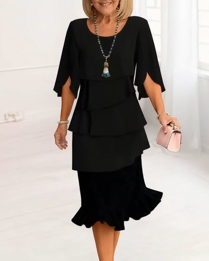 Front view of the Annabelle ruffle tiered midi dress in Black with split sleeves and layered skirt