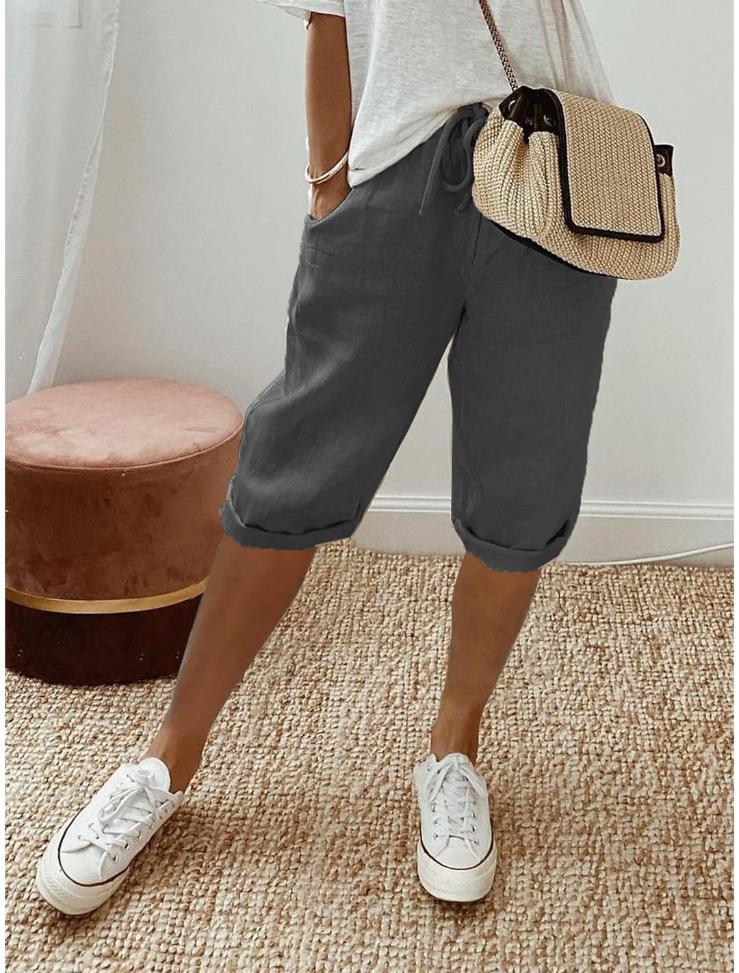 Front view of relaxed capri pants in blue showing mid-calf length and elastic drawstring waistband